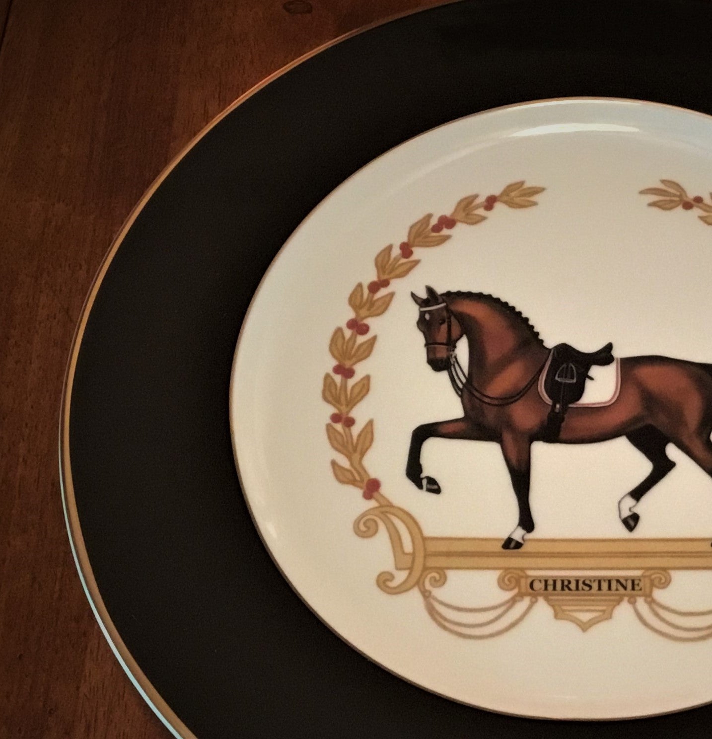dressage horse charger plate with black rim and double gold edging